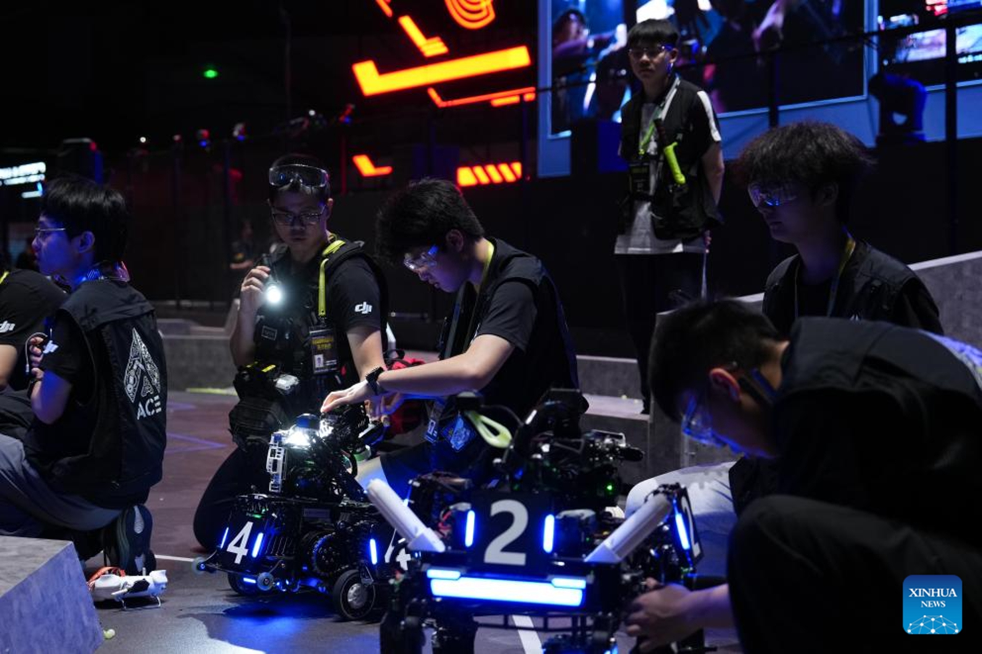 Contestants from Dongguan University of Technology test their robots during the RoboMaster 2026 University Championship Regional Competition in Changsha, central China's Hunan Province, May 17, 2026. The five-day regional competition concluded here on Sunday, with team Taurus from South China Agricultural University winning the first place. The competition attracted teams from 32 universities of China. (Xinhua/Chen Zhenhai)