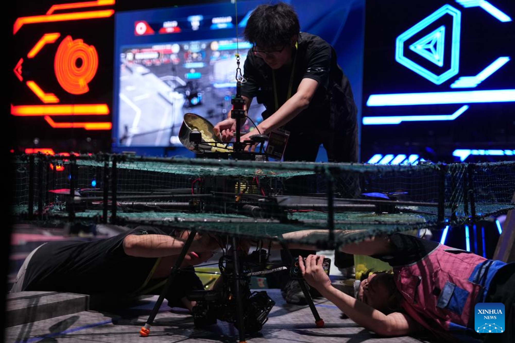 Contestants from South China Agricultural University test their robots during the RoboMaster 2026 University Championship Regional Competition in Changsha, central China's Hunan Province, May 17, 2026. The five-day regional competition concluded here on Sunday, with team Taurus from South China Agricultural University winning the first place. The competition attracted teams from 32 universities of China. (Xinhua/Chen Zhenhai)