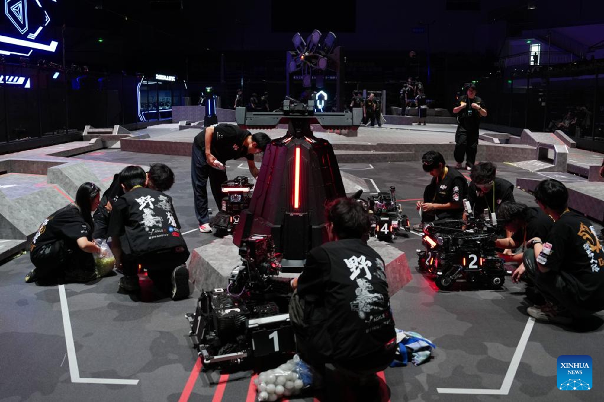Contestants from Guangzhou City University of Technology test their robots during the RoboMaster 2026 University Championship Regional Competition in Changsha, central China's Hunan Province, May 17, 2026. The five-day regional competition concluded here on Sunday, with team Taurus from South China Agricultural University winning the first place. The competition attracted teams from 32 universities of China. (Xinhua/Chen Zhenhai)