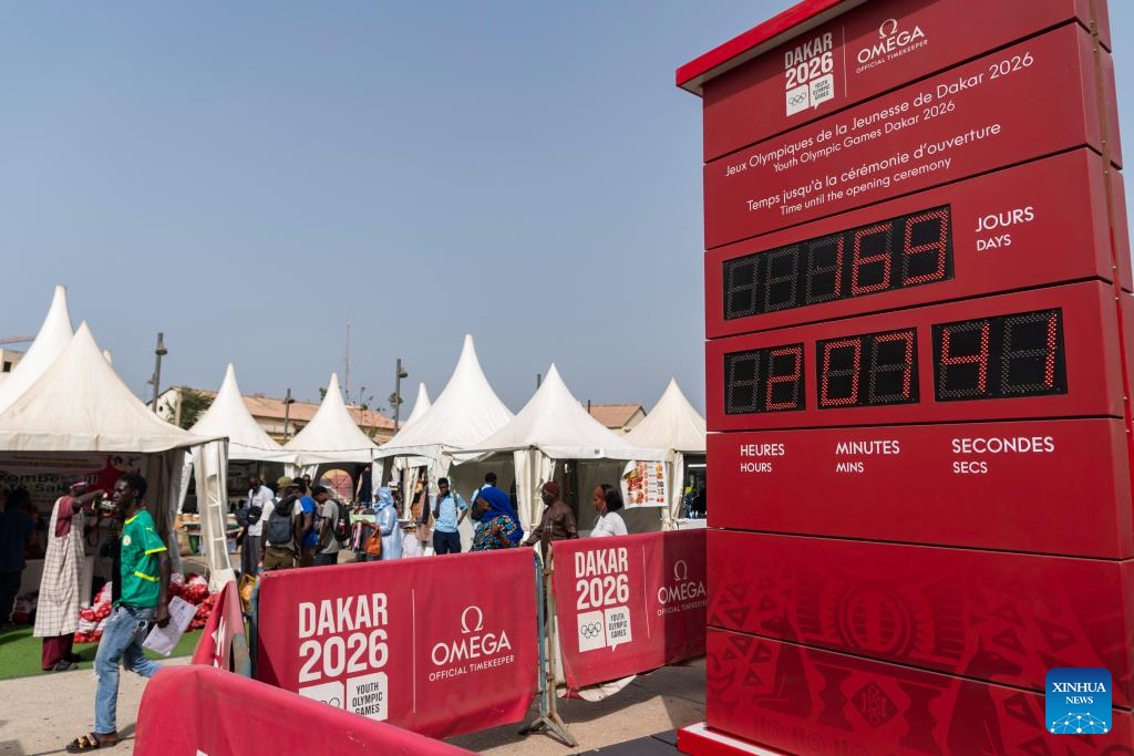 People walk by a countdown clock near Dakar Train Station, in Dakar, Senegal, on May 15, 2026. The Dakar 2026 Youth Olympic Games will be held from Oct. 31 to Nov. 13 in Dakar, becoming the first Olympic event ever staged on the African continent. (Photo: Xinhua)