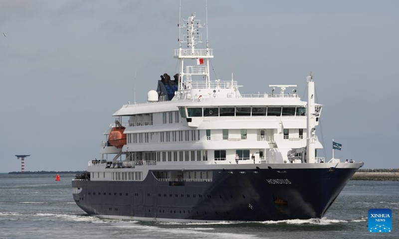 The hantavirus-hit cruise ship MV Hondius sails towards the port of Rotterdam in Rotterdam, the Netherlands, on May 18, 2026. The hantavirus-hit cruise ship MV Hondius arrived at the Dutch port of Rotterdam on Monday for disinfection, concluding a voyage that had drawn the attention of international health authorities. The crew members are set to enter quarantine immediately. Those unable to return to their home countries will undergo quarantine in the Netherlands, the Dutch health ministry said last week. (Photo: Xinhua)