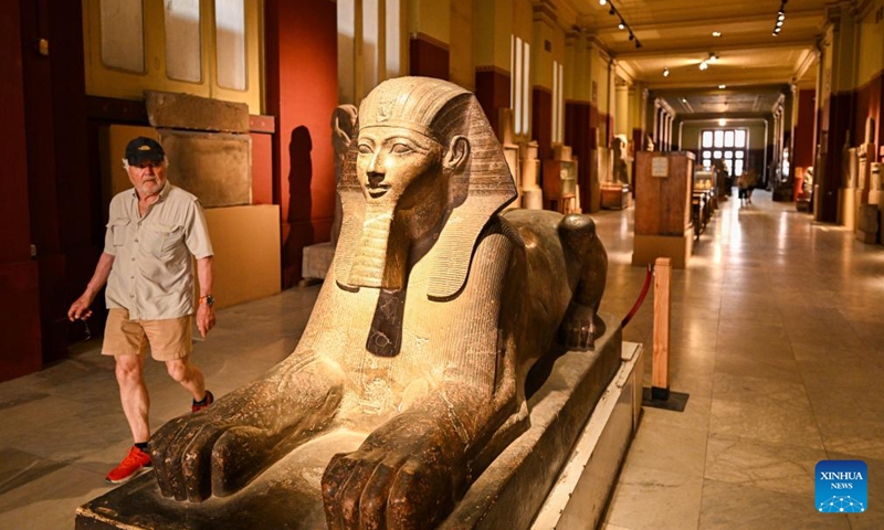 A visitor walks past a sphinx statue at the Egyptian Museum in Cairo, Egypt, May 17, 2026. May 18 marks International Museum Day. Visitors have flocked to museums across the country in recent days to feel the unique charm of ancient Egyptian civilization. (Photo: Xinhua)