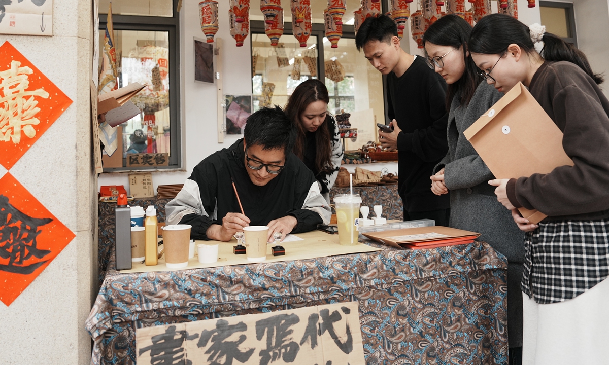 oung people join experiential qiaopi writing activities at an immersive qiaopi-themed exhibition curated by Zou Yuansheng in Xiamen, Fujian Province, in March 2026. Photo: Courtesy of Zou