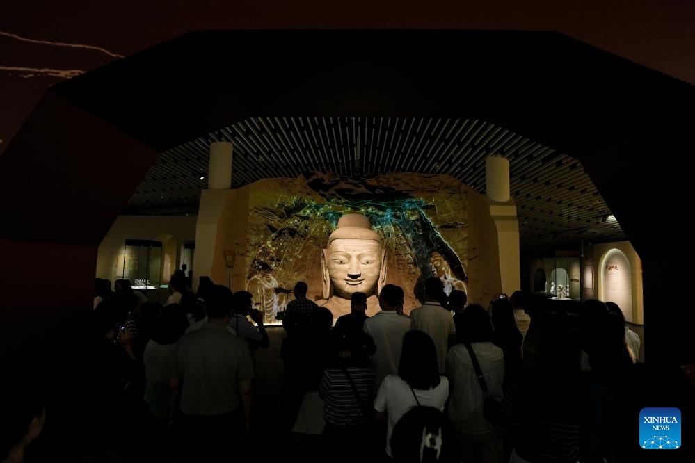 People visit the exhibition Yungang Grottoes: A world heritage site from the Pingcheng era of the Northern Wei Dynasty at the Sanxingdui Museum in Guanghan City, southwest China's Sichuan Province, May 18, 2026. Presenting over 120 pieces (sets) of exhibits, the exhibition kicked off here on Monday and will last till Oct. 31. (Photo: Xinhua)