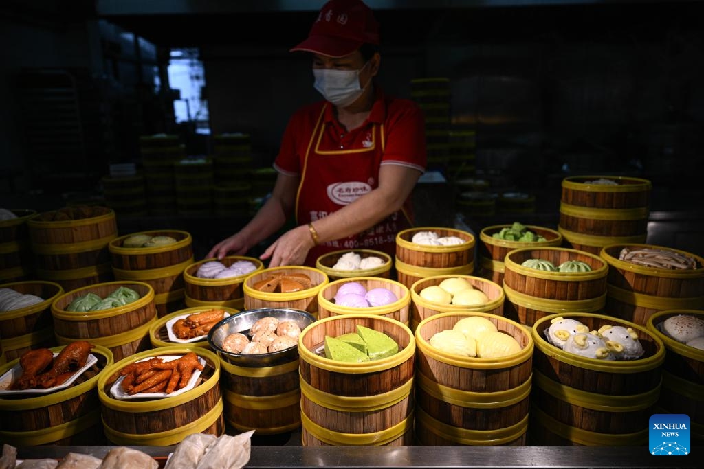 This photo taken on May 16, 2026 shows snacks at a Laobacha store in Wenchang, south China's Hainan Province. Laobacha is a beloved Hainan tradition where locals gather over fragrant tea, savory snacks, and leisurely chat. Wenchang in south China's Hainan is a renowned hometown of overseas Chinese, where cultures brought back by overseas Chinese from Southeast Asia have merged with the indigenous ones to form some very interesting customs in diet and entertainment. (Photo: Xinhua)