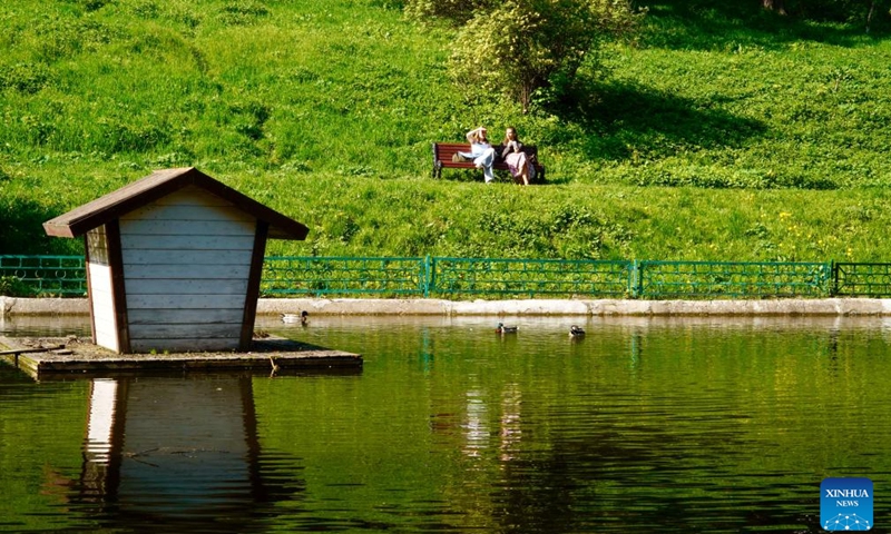 People enjoy leisure time at the Kolomenskoye park in Moscow, Russia, May 13, 2026. Moscow, the capital and largest city of Russia, stands as the country's political, economic, cultural and technological center. Its diverse architecture and vibrant cultural atmosphere highlight a long history and a strong artistic taste of the city. (Photo: Xinhua)