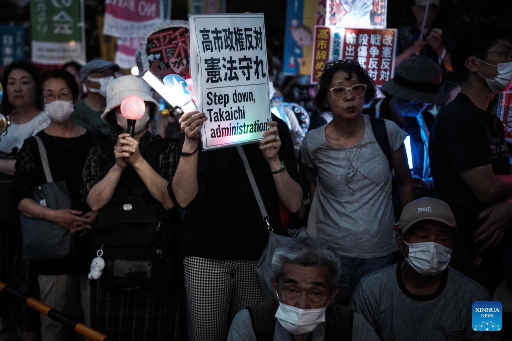 People holding slogans participate in a protest rally in front of the National Diet Building in Tokyo, Japan, May 19, 2026. Thousands of demonstrators gathered in front of Japan's National Diet Building in Tokyo on Tuesday evening to protest the government's attempts to undermine the country's pacifist constitution through constitutional revision and military expansion policies. (Photo: Xinhua)