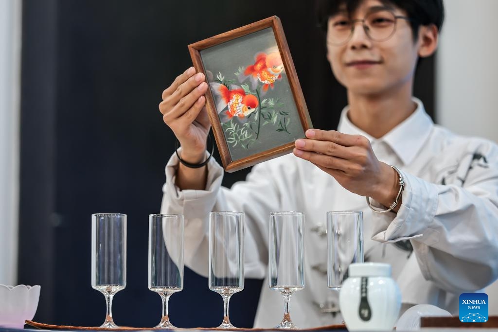 A tea master demonstrates Suzhou embroidery during a Chinese tea cultural event in Budapest, Hungary, on May 19, 2026. A Chinese tea cultural event themed Tea: The Taste of Harmony was held Tuesday in Budapest to promote cultural exchanges between China and Hungary through traditional tea ceremonies and artistic performances. (Photo: Xinhua)