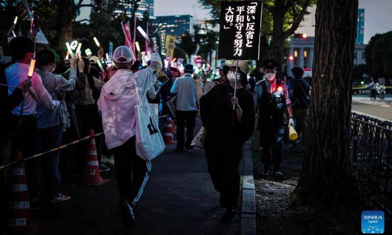 People holding slogans participate in a protest rally in front of the National Diet Building in Tokyo, Japan, May 19, 2026. Thousands of demonstrators gathered in front of Japan's National Diet Building in Tokyo on Tuesday evening to protest the government's attempts to undermine the country's pacifist constitution through constitutional revision and military expansion policies. (Photo: Xinhua)