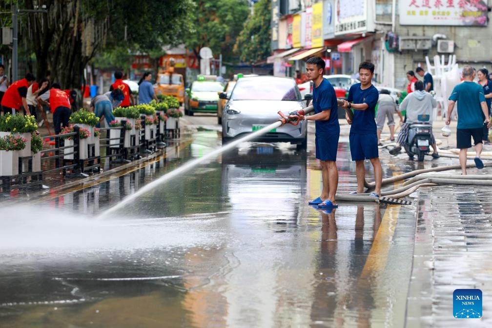 Rescuers clean a road in Duyun City, southwest China's Guizhou Province, May 19, 2026. Heavy rains lashed Duyun City from 6 a.m. Monday to 6 a.m. Tuesday. Flood control and disaster relief work are underway in flood-hit areas. (Photo: Xinhua)