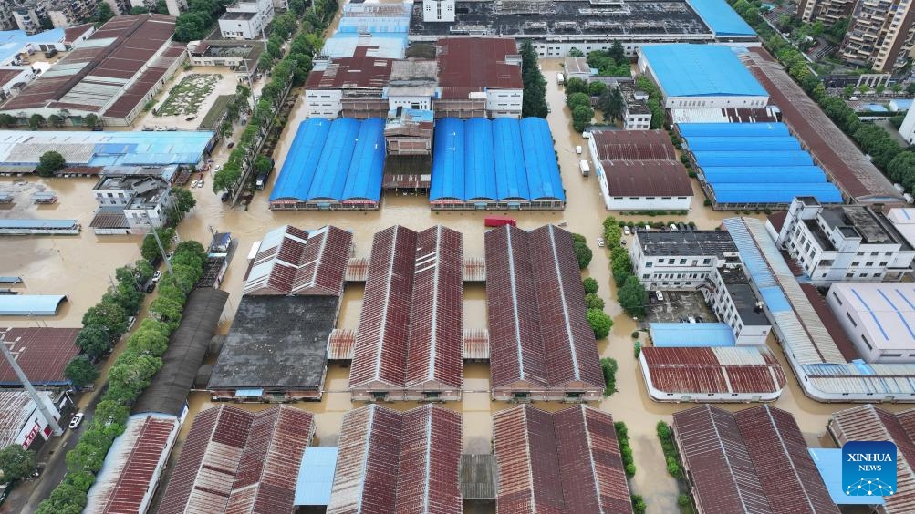An aerial drone photo taken on May 19, 2026 shows factories in a flood-hit area in Duyun City, southwest China's Guizhou Province. Heavy rains lashed Duyun City from 6 a.m. Monday to 6 a.m. Tuesday. Guizhou geological disaster prevention and control headquarters activated a Level III alert for geological disasters in the Qiandongnan, Qiannan and Qianxinan prefectures. (Photo: Xinhua)
