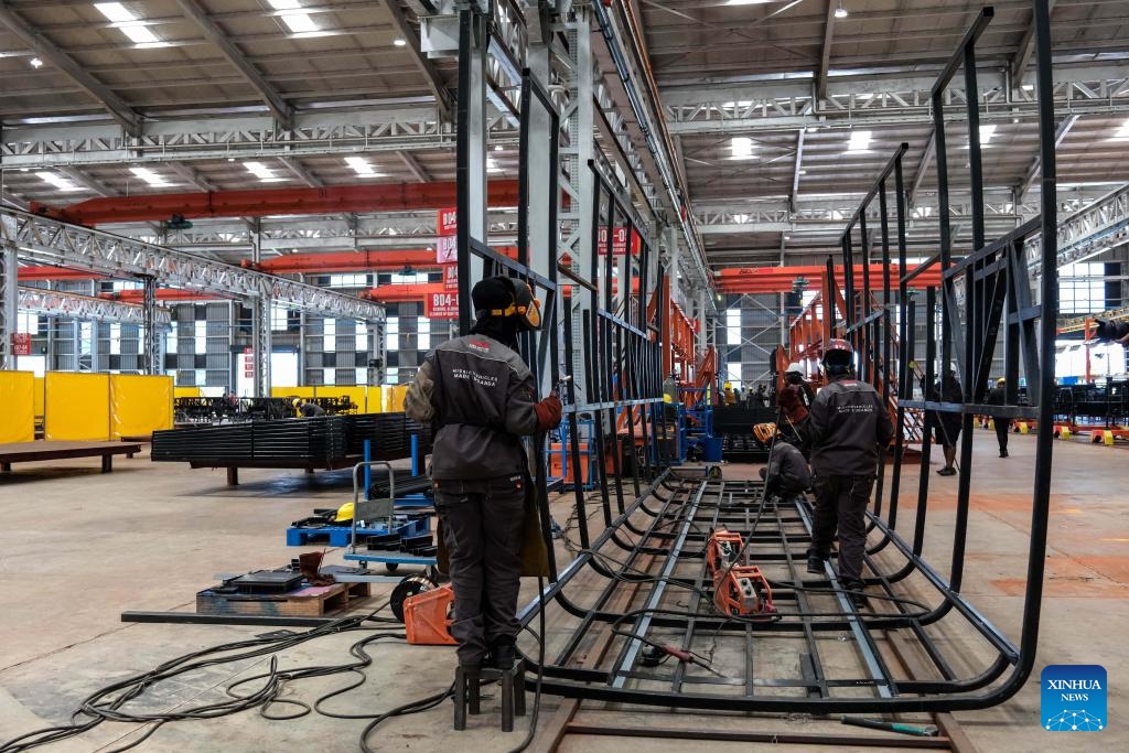 Workers weld a bus frame inside the electric bus workshop at the Kiira Vehicle Plant in Jinja, Eastern Uganda, on May 18, 2026. (Photo: Xinhua)