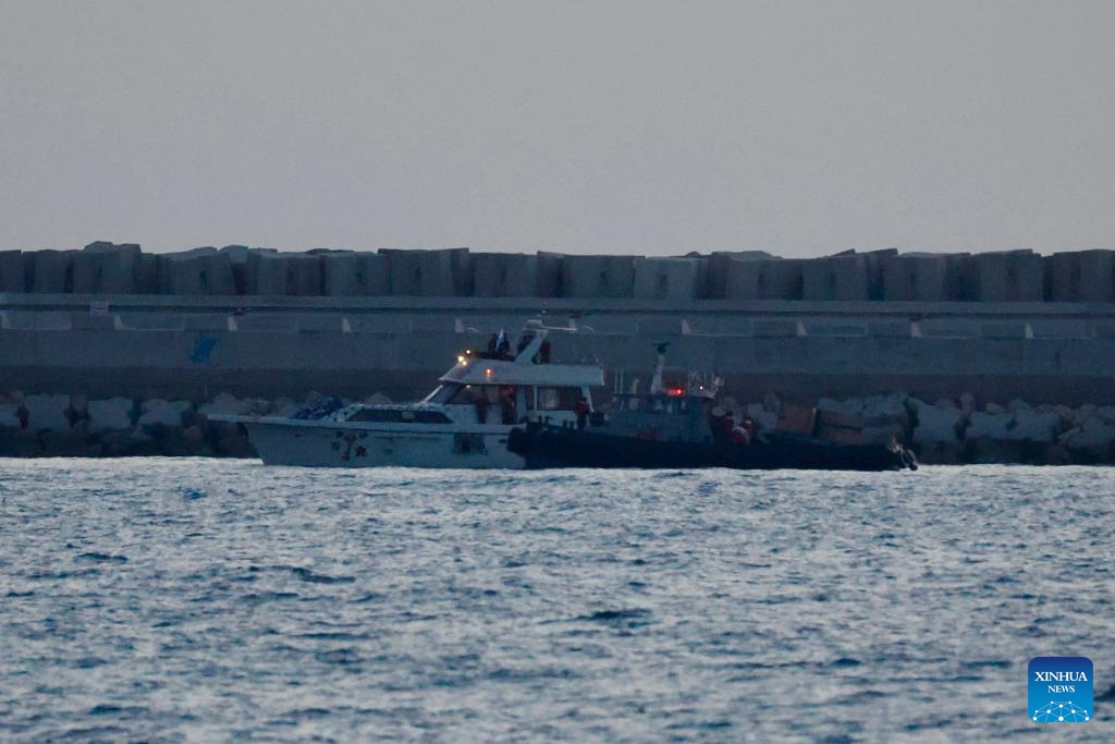 A boat of the Gaza-bound aid flotilla (L), after being intercepted by the Israeli navy, is escorted toward the Israeli port of Ashdod, Israel, on May 19, 2026. Israel said late Tuesday that it had intercepted all boats in a Gaza-bound aid flotilla, detaining hundreds of activists and transporting them to Israel. (Photo: Xinhua)