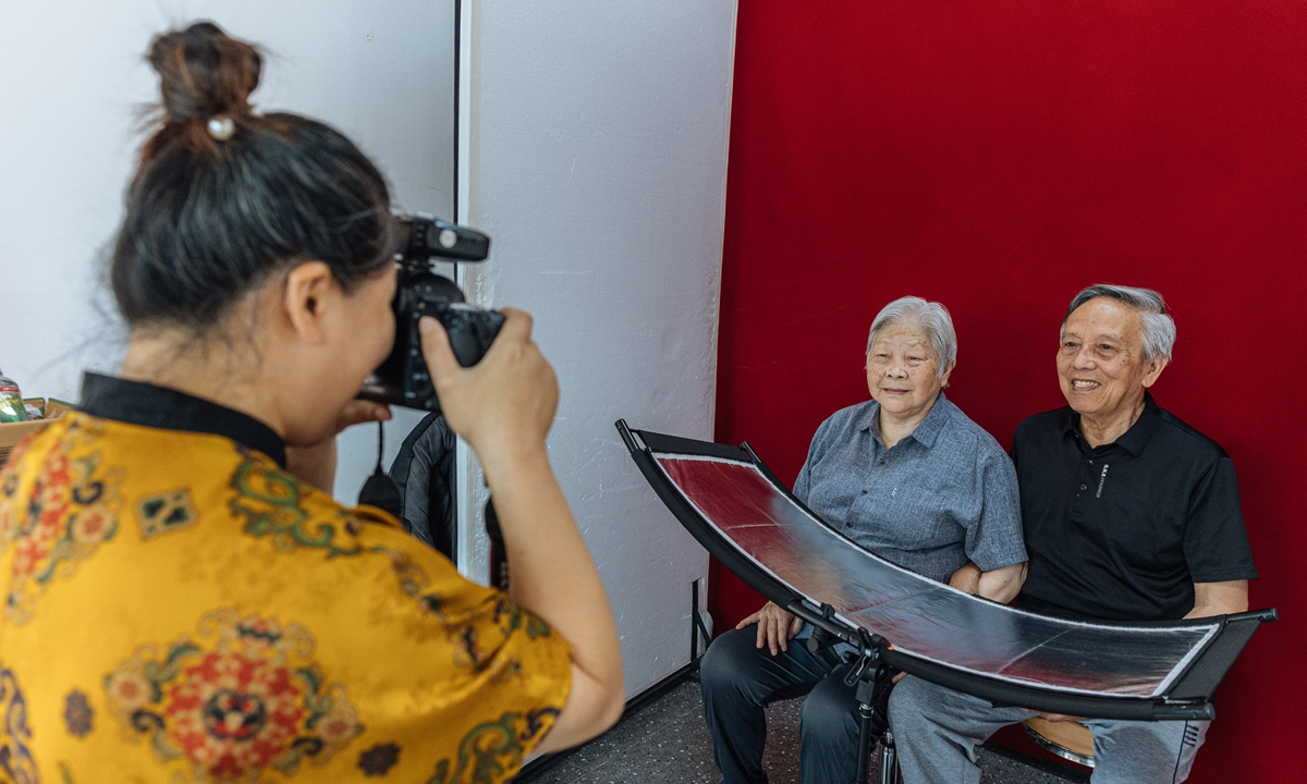 Ninety-year-old Zhang Weiyu (right) and his wife Liu Yichun, 88, pose for a photo for a replacement marriage certificate at a marriage registration office in Beijing, on May 20, 2026. The couple married in 1963, and have been together for more than 60 years. Photo: Li Hao/GT