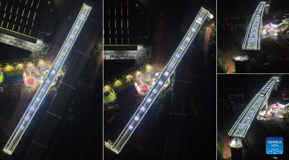 A combo photo taken on May 18 and 19, 2026 shows an aerial view of a continuous beam of the Xijiang River Grand Bridge during its rotation process in Zhaoqing, south China's Guangdong Province. A rotating girder of the Xijiang River Grand Bridge completed its rotation on Tuesday, crossing two existing high-speed railways. The 8,324-meter bridge is a key project of the Zhuhai-Zhaoqing high-speed railway under construction. The railway is expected to improve transport links in the Guangdong-Hong Kong-Macao Greater Bay Area. (Photo: Xinhua)