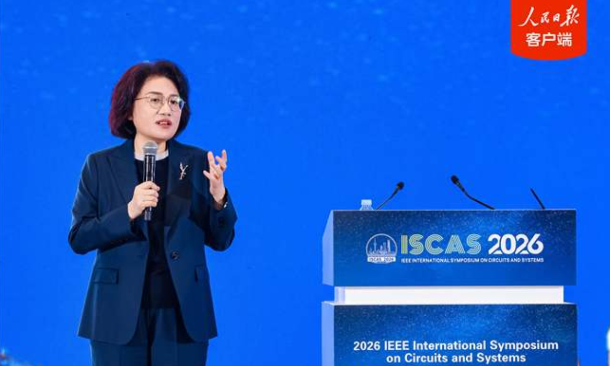 He Tingbo, a Huawei board member and president of the company’s semiconductor business department, unveils the Tau (τ) Scaling Law, on March 25, 2026. Photo: People’s Daily