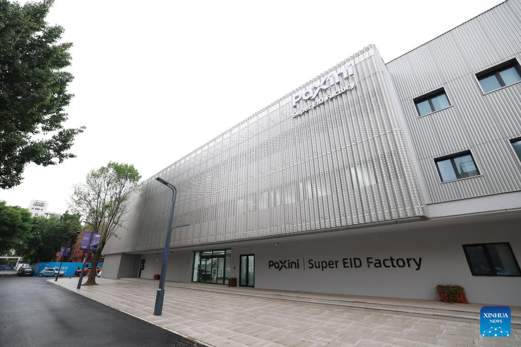 This photo taken on May 20, 2026 shows the exterior view of the Paxini Super EID Factory in 764 Aerospace, north China's Tianjin Municipality. Located on the site of a former state-owned broadcasting equipment factory, the 764 Aerospace, a digital industrial park in Hexi District of Tianjin, is home to more than 10 high-tech enterprises. Featuring embodied intelligence industry, the park focuses on advancing embodied intelligence data collection, robot debugging, algorithm R&D and scenario implementation, and has built a full-chain industrial cluster covering the whole process from data collection to scenario deployment. (Xinhua/Sun Fanyue)
