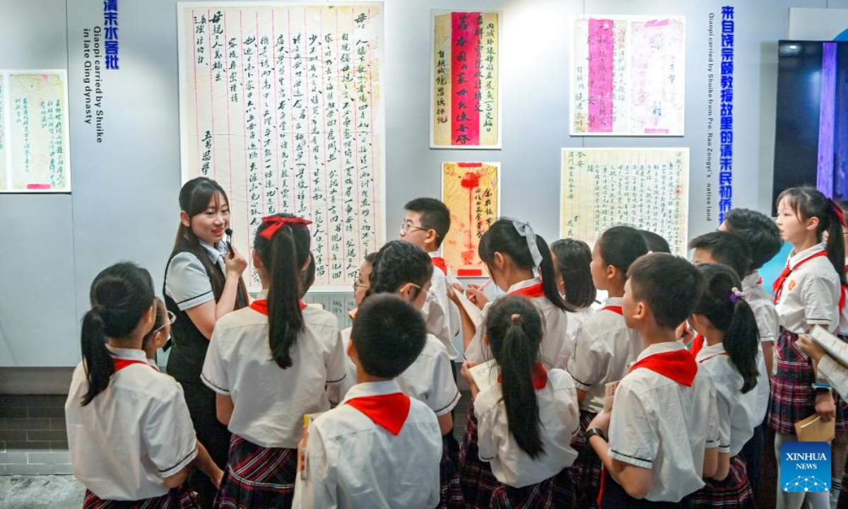 Students visit a museum dedicated to qiaopi in Shantou, south China's Guangdong Province, May 18, 2026. Qiaopi -- letters and remittances sent home by earlier generations of overseas Chinese -- once traveled quietly across oceans, carrying longing and news from distant lives back to families waiting in China. (Photo by Lin Peng/Xinhua)