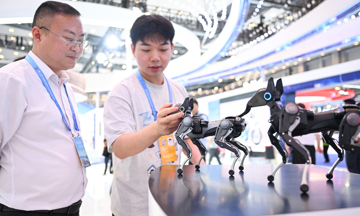 Intelligent, small-scale quadruped robots gain the attention of visitors at the 8th Western China International Fair for Investment and Trade that kicked off in Southwest China's Chongqing on May 21, 2026. Themed 