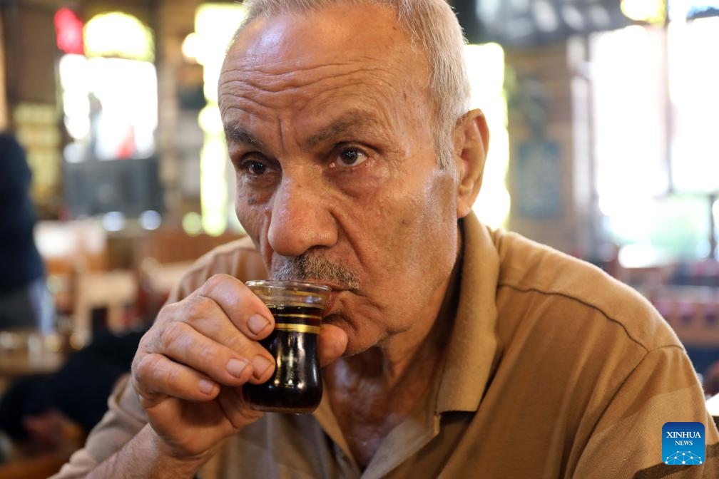A man drinks tea at a teahouse in Baghdad, Iraq, on May 21, 2026. International Tea Day is observed on May 21 annually. (Xinhua/Khalil Dawood)