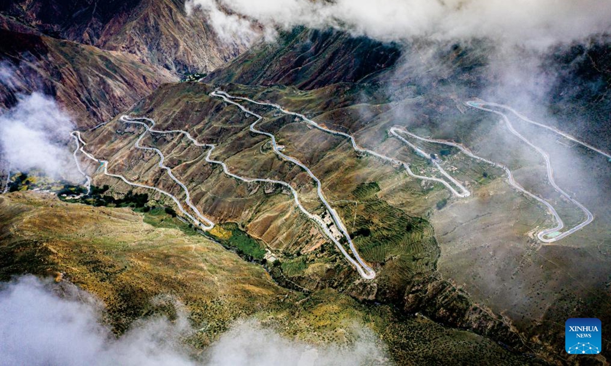 An aerial drone photo taken on July 16, 2020 shows part of Nujiang River zigzag road on the Sichuan-Xizang highway in Baxoi County, southwest China's Xizang Autonomous Region. This year marks the 75th anniversary of the peaceful liberation of Xizang. Today, the once formidable plateau has become highly accessible as a comprehensive transportation system has been established, which centered in the capital city of Lhasa and radiating to various cities and prefectures. (Photo by Wang Shimin/Xinhua)