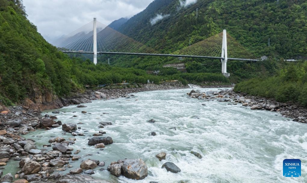 An aerial drone photo taken on July 16, 2020 shows part of Nujiang River zigzag road on the Sichuan-Xizang highway in Baxoi County, southwest China's Xizang Autonomous Region. This year marks the 75th anniversary of the peaceful liberation of Xizang. Today, the once formidable plateau has become highly accessible as a comprehensive transportation system has been established, which centered in the capital city of Lhasa and radiating to various cities and prefectures. (Photo by Wang Shimin/Xinhua)
