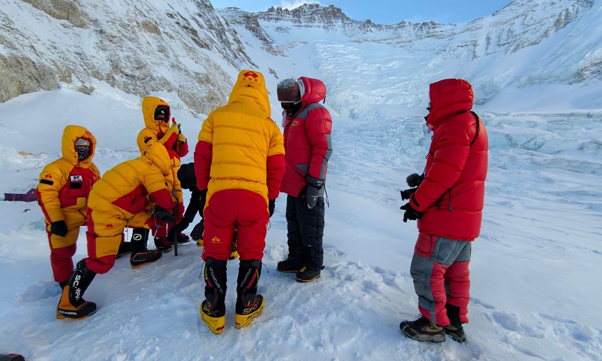Members of the scientific expedition team conduct ice core drilling near the C2 camp at an altitude of 6,200 meters on Mount Qomolangma. Photo: Courtesy of Polar Hub