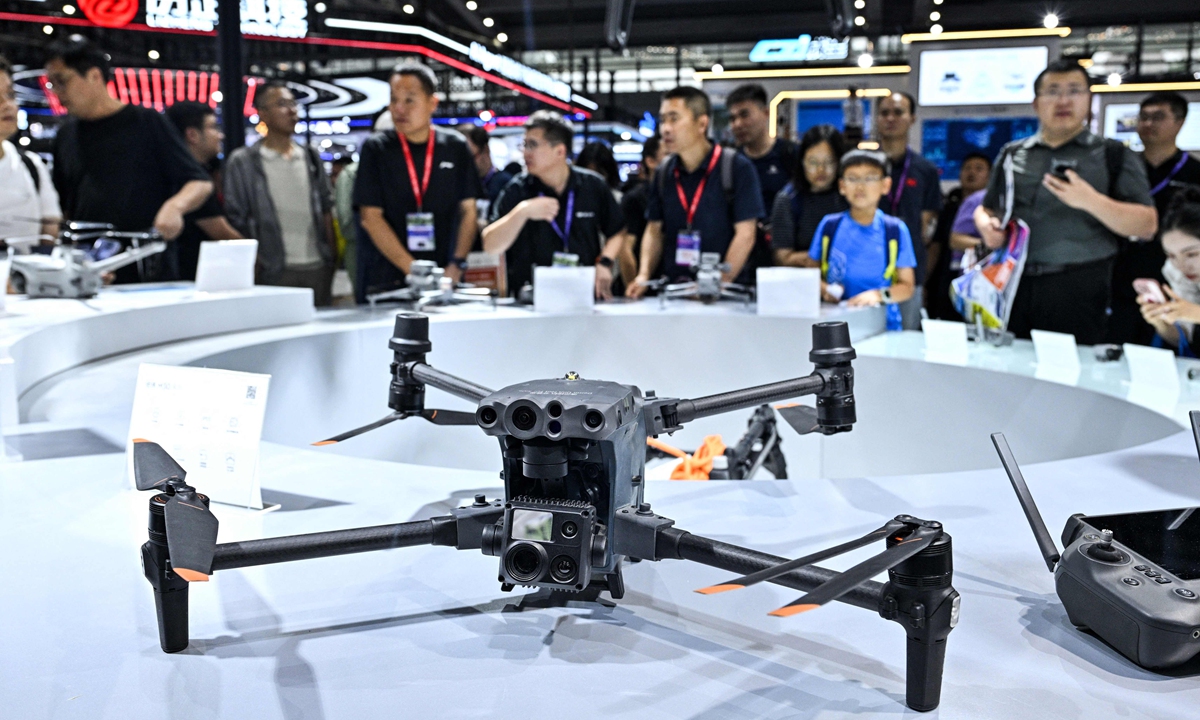 Visitors tour the DJI exhibition booth during the World Drone Congress (DWC) in Shenzhen, South China's Guangdong Province, on Thursday, May 21, 2026. Photo：VCG