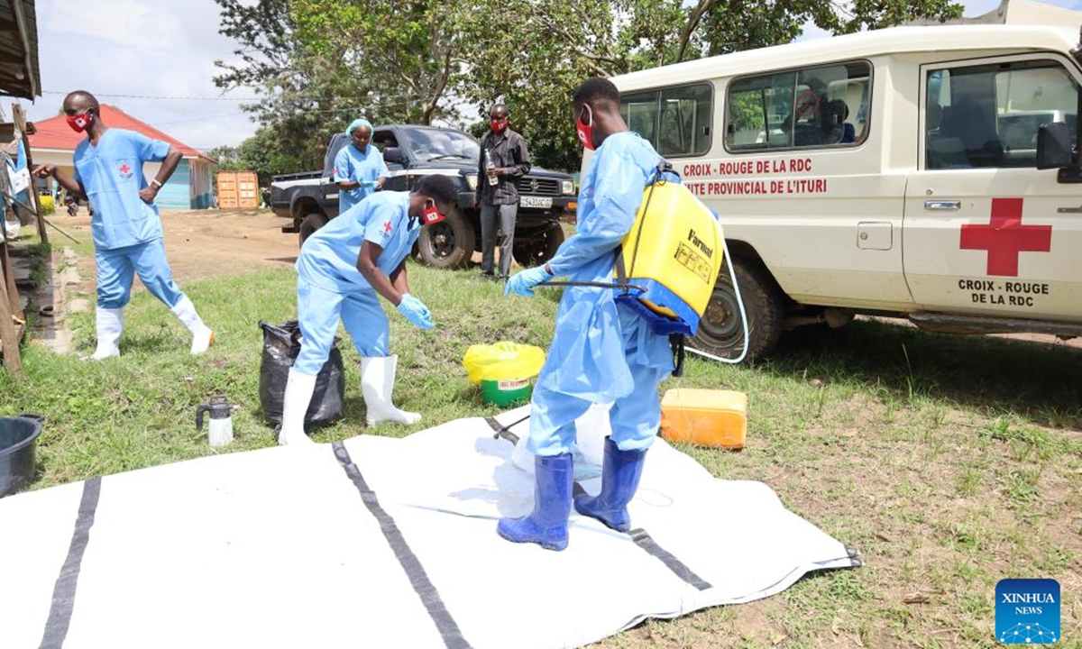 Medical worker disinfect equipments before the burial of a suspected Ebola victim in Bunia, Ituri Province, the Democratic Republic of the Congo, on May 21, 2026. The outbreak, initially reported in Ituri Province, has now affected North Kivu and South Kivu, while two confirmed cases have also been reported in the neighboring country of Uganda. (Str/Xinhua)