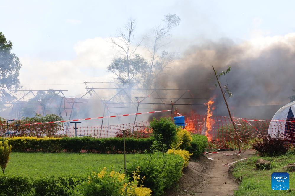An Ebola isolation site is set on fire in Rwampara town, near Bunia of Ituri Province, the Democratic Republic of the Congo, on May 21, 2026. The outbreak, initially reported in Ituri Province, has now affected North Kivu and South Kivu, while two confirmed cases have also been reported in the neighboring country of Uganda. (Str/Xinhua)
