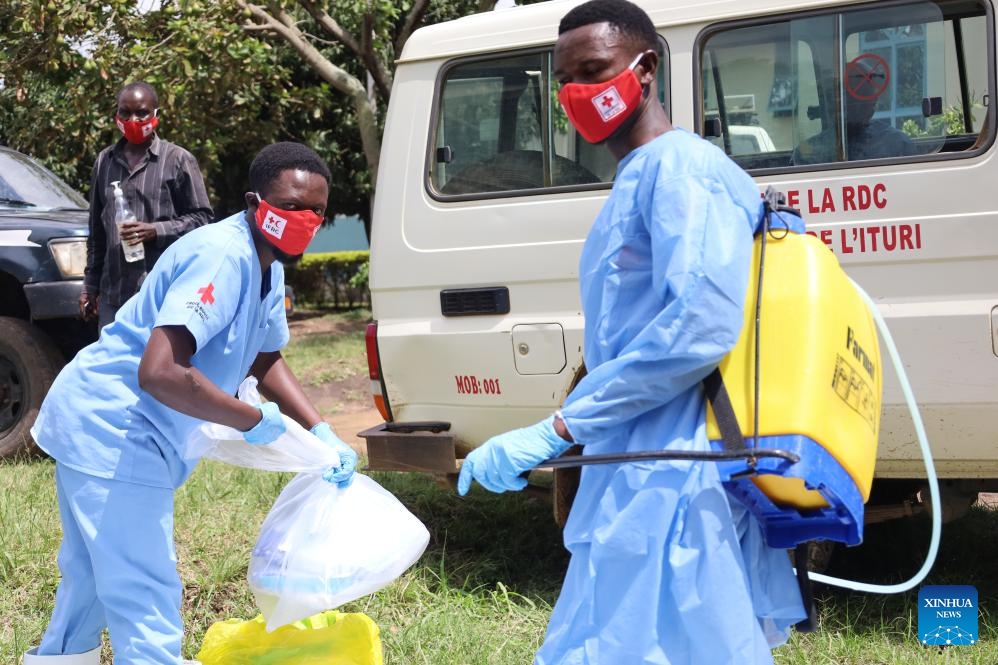 Medical worker disinfect equipments before the burial of a suspected Ebola victim in Bunia, Ituri Province, the Democratic Republic of the Congo, on May 21, 2026. The outbreak, initially reported in Ituri Province, has now affected North Kivu and South Kivu, while two confirmed cases have also been reported in the neighboring country of Uganda. (Str/Xinhua)