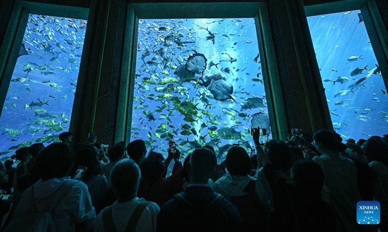 People visit the aquarium of Atlantis Sanya in Sanya, south China's Hainan Province, Jan. 15, 2026. As a landmark in marine culture and tourism in the Hainan Free Trade Port, the aquarium of Atlantis Sanya focuses on the breeding of marine species, exhibitions and education, attracting a large number of domestic and foreign visitors to explore. (Photo: Xinhua)