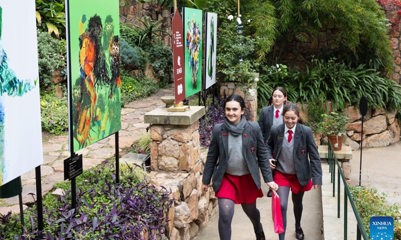 People walk past exhibits during the RMB Latitudes Art Fair 2026 at the Shepstone Gardens in Johannesburg, South Africa, May 22, 2026. The art fair, scheduled from May 22 to 24, covers a wide range of artistic fields including painting, sculpture, photography, and design. (Photo: Xinhua)