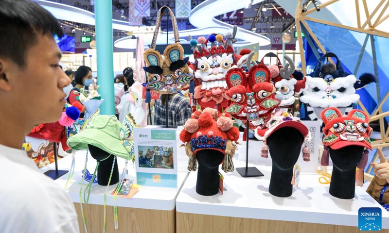 A visitor learns about creative cultural products at the booth of Guangxi Zhuang Autonomous Region during the 22nd China (Shenzhen) International Cultural Industries Fair in Shenzhen, south China's Guangdong Province, May 22, 2026.

The 22nd China (Shenzhen) International Cultural Industries Fair kicked off here on Thursday, showcasing over 120,000 cultural products. The Creative China exhibition area brings together domestic cultural IPs, sci-tech innovation products, cultural and tourism products, intangible cultural heritage products, and popular creative cultural products. Creative cultural products from more than 30 famous domestic cultural heritage institutions and museums are also showcased during the event, attracting numerous visitors. Photo: Xinhua