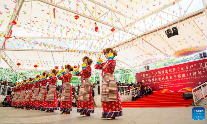 This photo taken on May 22, 2026 shows a scene of an event marking the 75th anniversary of the peaceful liberation of Xizang in Lhasa, southwest China's Xizang Autonomous Region. Xizang marks the 75th anniversary of its peaceful liberation on Saturday. People here celebrated with singing and dancing, praising a better life. (Xinhua/Tenzin Nyida)