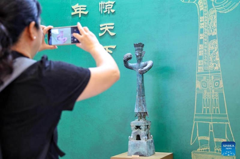 A visitor takes photos of an exhibit at the booth of the Sanxingdui Museum during the 22nd China (Shenzhen) International Cultural Industries Fair in Shenzhen, south China's Guangdong Province, May 22, 2026.

The 22nd China (Shenzhen) International Cultural Industries Fair kicked off here on Thursday, showcasing over 120,000 cultural products. The Creative China exhibition area brings together domestic cultural IPs, sci-tech innovation products, cultural and tourism products, intangible cultural heritage products, and popular creative cultural products. Creative cultural products from more than 30 famous domestic cultural heritage institutions and museums are also showcased during the event, attracting numerous visitors. Photo: Xinhua