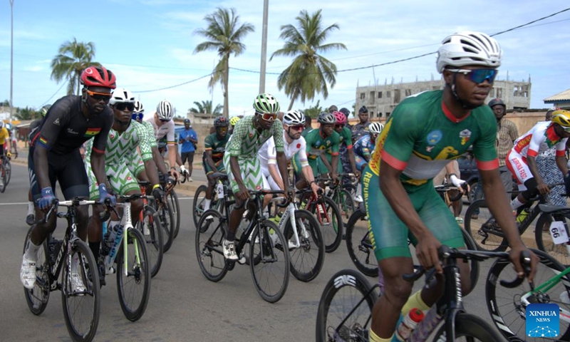 Cyclists compete at the starting line of the fourth stage in Aneho, Togo, May 23, 2026. The 31st International Cycling Tour of Togo concluded Saturday evening in Lome, the Togolese capital. (Xinhua/Si Yuan)