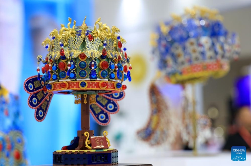 This photo taken on May 22, 2026 shows an assembly model replicating a delicate empress crown from the Ming dynasty (1368-1644) at the 22nd China (Shenzhen) International Cultural Industries Fair in Shenzhen, south China's Guangdong Province.

The 22nd China (Shenzhen) International Cultural Industries Fair kicked off here on Thursday, showcasing over 120,000 cultural products. The Creative China exhibition area brings together domestic cultural IPs, sci-tech innovation products, cultural and tourism products, intangible cultural heritage products, and popular creative cultural products. Creative cultural products from more than 30 famous domestic cultural heritage institutions and museums are also showcased during the event, attracting numerous visitors. Photo: Xinhua