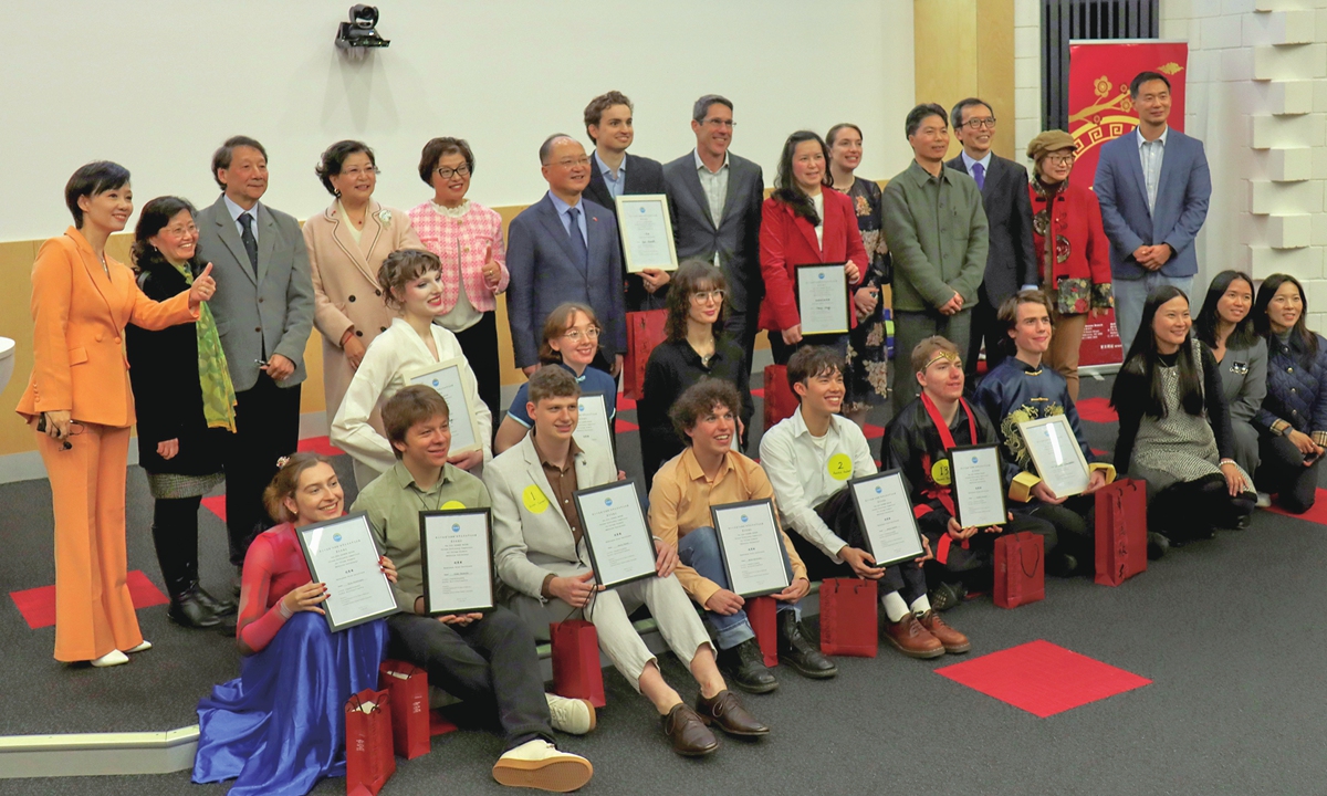 Guests and contestants pose for a group photo after the Melbourne regional preliminary round of the 25th 
