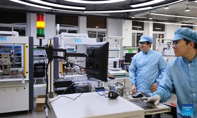 Fu Mingda (L) works with his colleague on the joint assembly line at Galileo (Tianjin) Technology Co., Ltd. in Tianjin, north China, May 22, 2026. Thirty-three-year-old Fu Mingda, an electromagnetic engineering designer at Galileo (Tianjin) Technology Co., Ltd., has his sights set on becoming a technical expert in the motor industry. To that end, he has been tackling key challenges in the independent research and development (R&D) of core robotic components.
After earning his master's degree from Shenyang University of Technology in 2018, Fu relocated to Tianjin to focus on the R&D and design of aviation motors. He later joined Galileo, where he was involved in the in-house development of quadruped robot joint modules from the ground up.
At the time, the company relied on externally procured joint modules that were prone to overheating and damage. Furthermore, these outsourced parts could not meet complex performance requirements, such as performing somersaults, climbing slopes, and carrying heavy loads.
In less than six months, Fu achieved a technological breakthrough. Overseeing the process from initial electromagnetic design to supplier development, assembly, and testing, he drove the project through four major iterations and dozens of minor optimizations. Impressively, the very first prototype reached advanced standards in the industry.
Today, fueled by the rapid growth of China's domestic robotics industry, Fu remains busier than ever. He expressed full confidence that, through continued dedication, he will realize his ambition of becoming a leading technical expert in the motor sector. Photo: Xinhua