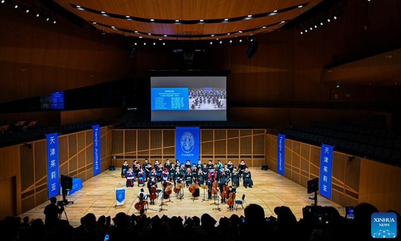 This photo taken on May 23, 2026 shows a scene at the commencement at the Tianjin Juilliard School in north China's Tianjin Municipality. The Tianjin Juilliard School held the commencement for its postgraduate class of 2026 on Saturday. A total of 42 postgraduate students from 14 countries and regions completed their studies here successfully. (Photo by Du Penghui/Xinhua)
