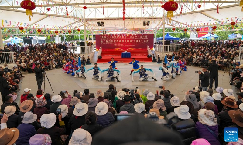 This photo taken on May 22, 2026 shows a scene of an event marking the 75th anniversary of the peaceful liberation of Xizang in Lhasa, southwest China's Xizang Autonomous Region. Xizang marks the 75th anniversary of its peaceful liberation on Saturday. People here celebrated with singing and dancing, praising a better life. (Xinhua/Jigme Dorje)