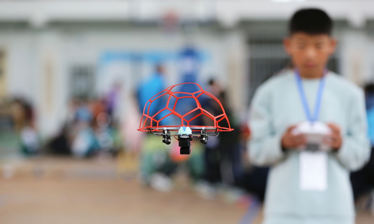 A contestant takes part in a drone transport mission flight competition at a school in Dingxi, Northwest China's Gansu Province on May 24, 2026. The technology model competition aims to guide young people and foster an atmosphere that values a love of science and a spirit of innovation. Photo: VCG