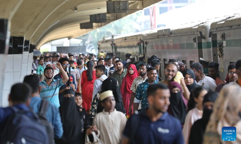 People are pictured during the Eid al-Adha travel rush at Kamalapur Railway Station in Dhaka, Bangladesh, May 24, 2026. As Eid al-Adha approaches, many people from Dhaka have streamed out of the city to join the festival with their kith and kin in hometowns. (Photo by Habibur Rahman/Xinhua)