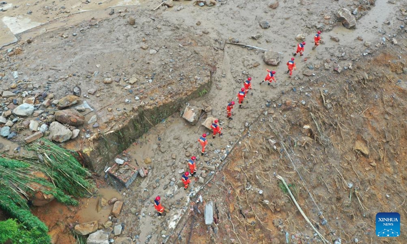 An aerial drone photo taken on May 24, 2026 shows rescuers working on site after a heavy rainstorm hit Yongchuan District in southwest China's Chongqing Municipality. (Xinhua/Wang Quanchao)