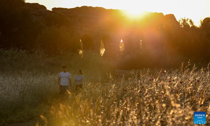People walk at the Park of the Aqueducts in Rome, Italy, May 23, 2026. (Xinhua/Li Jing)