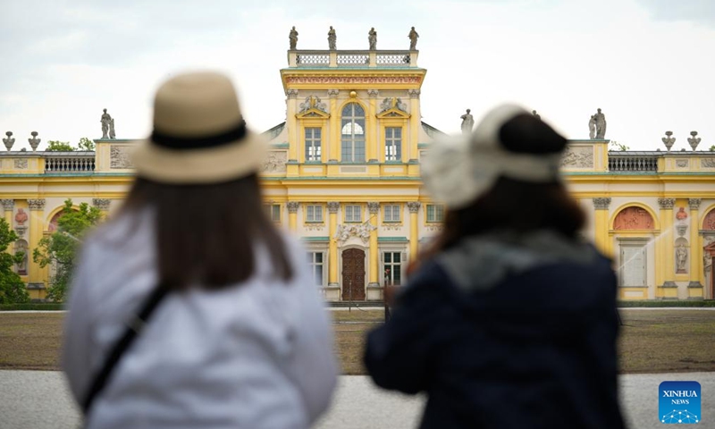 Visitors are seen at the main courtyard of Wilanow Palace in Warsaw, Poland, on May 23, 2026. The palace courtyard was officially opened to the public free of charge starting Saturday. (Photo by Jaap Arriens/Xinhua)
