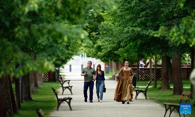 Visitors walk in the park area of Wilanow Palace in Warsaw, Poland, on May 23, 2026. The palace courtyard was officially opened to the public free of charge starting Saturday. (Photo by Jaap Arriens/Xinhua)