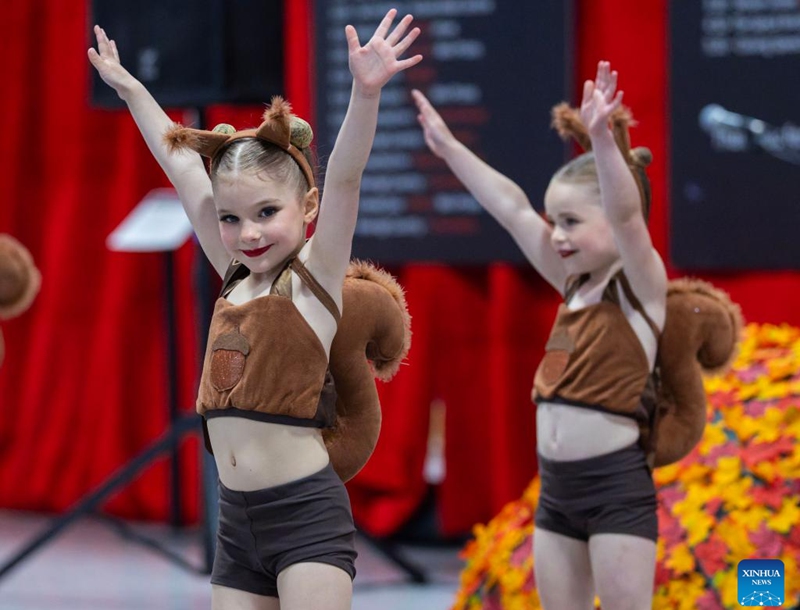 Children dance during the 2026 Carassauga Festival of Cultures in Mississauga, Ontario, Canada, May 23, 2026. The two-day annual cultural event kicked off here on Saturday, featuring diverse cuisine, stage shows and interactive experiences. (Photo by Zou Zheng/Xinhua)
