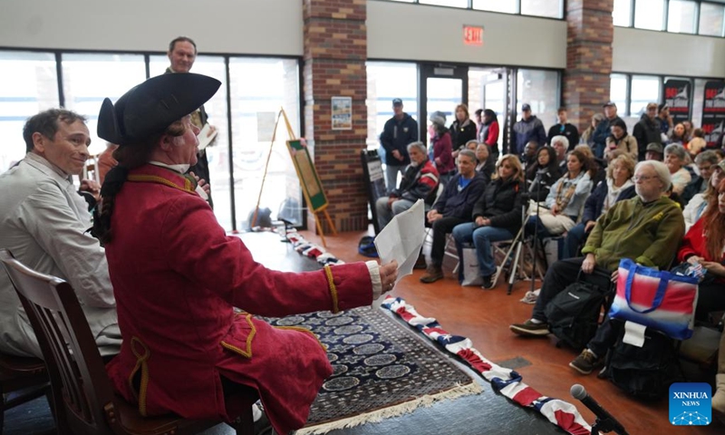 People watch a reenactment of the Continental Congress meeting during the Re-enactment Village event in Long Island of New York, the United States, on May 23, 2026. An event titled the Re-enactment Village kicked off in New York on Saturday to recreate the daily life of 18th-century. (Xinhua/Zhang Fengguo)